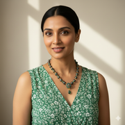Woman wearing Emerald, Fire Opal and Black Pearl Necklace